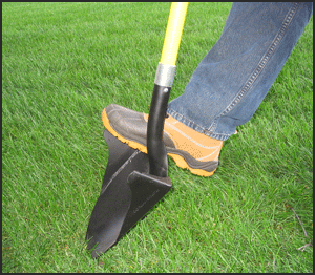 Boot planted on the extra-wide foot step of the One Shot Shovel